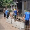 TNI dan Warga Gotong Royong Bangun Saluran Air Permanen di TMMD H+14