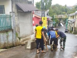 Hujan Tak Hambat Satgas TMMD, Saluran Drainase Sukamaju Hampir Rampung